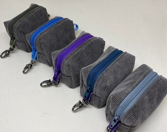 Gray Corduroy airpod case, mini duffle bag, key fob, small zipper pouch