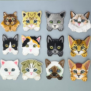 May include: Set of 12 embroidered iron-on patches featuring various cat designs. The patches are colourful and feature different cat breeds, including tabby, calico, Siamese, and black cats.