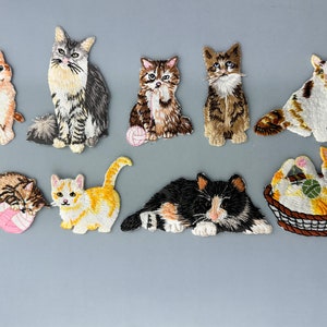 May include: Ten embroidered iron-on patches featuring various colourful cats in different poses. The patches are perfect for adding a playful touch to clothing, bags, or other fabric items.