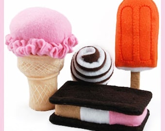 May include: A set of four felt food items: a pink ice cream cone, a chocolate and white swirl ice cream ball, a chocolate and pink ice cream sandwich, and an orange popsicle.