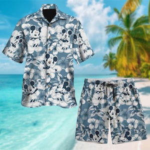 May include: A blue and white Hawaiian shirt and matching shorts featuring a repeating pattern of Mickey Mouse characters and tropical flowers.
