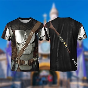A t-shirt design featuring a detailed image of a futuristic-looking suit with a belt and a gun-like weapon attached to the back.