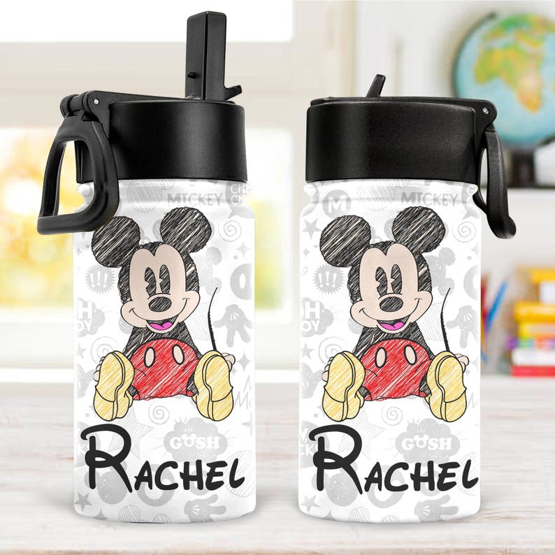 May include: Two white water bottles with black lids and handles. Each bottle features a sketch of Mickey Mouse in black, red, and yellow. The name "Rachel" is printed in black script below the character.