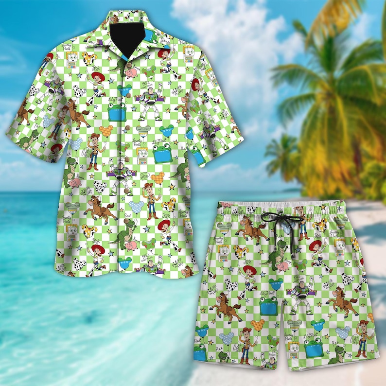 May include: A two-piece matching set featuring a short-sleeved button-down shirt and shorts. The set has a green and white checkered pattern with cartoon character illustrations. The shorts have a drawstring waist. The background shows a beach scene.