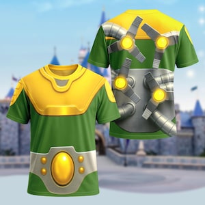 May include: Green and yellow short-sleeve t-shirt with a futuristic design. The front features a yellow chest plate and a silver belt with a large yellow oval. The back has a design of silver tubes and propellers with yellow lights.