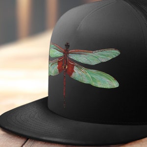 May include: Black trucker hat with a green and red dragonfly graphic on the front.