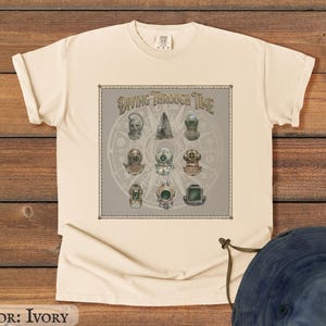 May include: A white ceramic mug with a black handle and the text "But First, Coffee" in a handwritten style. The mug is on a white surface. The mug is approximately 4 inches tall.