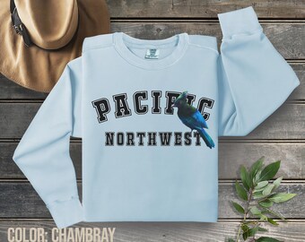 Stellers Jay Pacific Northwest (PNW) op een Comfort Colors-sweatshirt