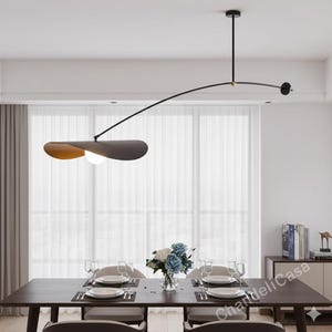 May include: A handmade wooden sign with the text "Welcome" in a handwritten style. The sign is painted white with a distressed finish, and a small green leaf is attached to the top. The sign is designed for indoor or outdoor use.