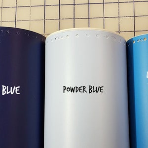 May include: Three rolls of vinyl adhesive film in dark blue, powder blue, and light blue. The rolls are labelled "DARK BLUE", "POWDER BLUE", and "LIGHT BLUE".