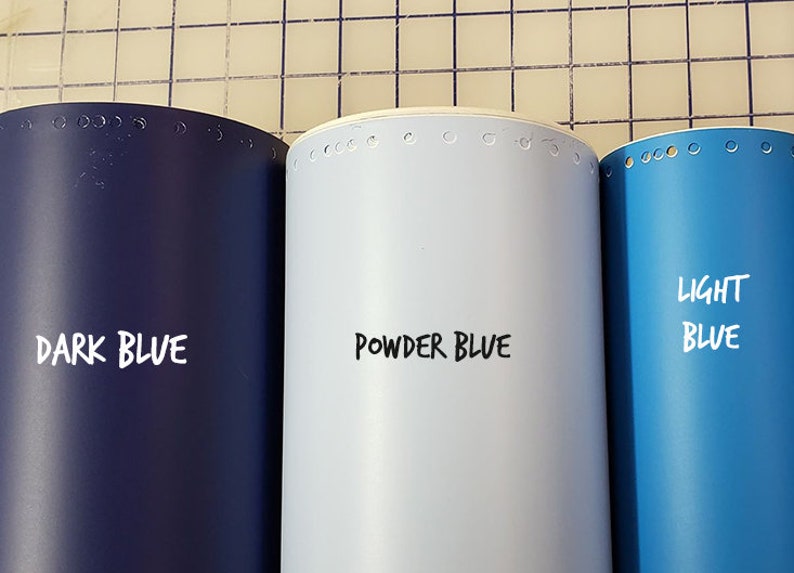 May include: Three rolls of vinyl adhesive film in dark blue, powder blue, and light blue. The rolls are labeled "DARK BLUE", "POWDER BLUE", and "LIGHT BLUE".