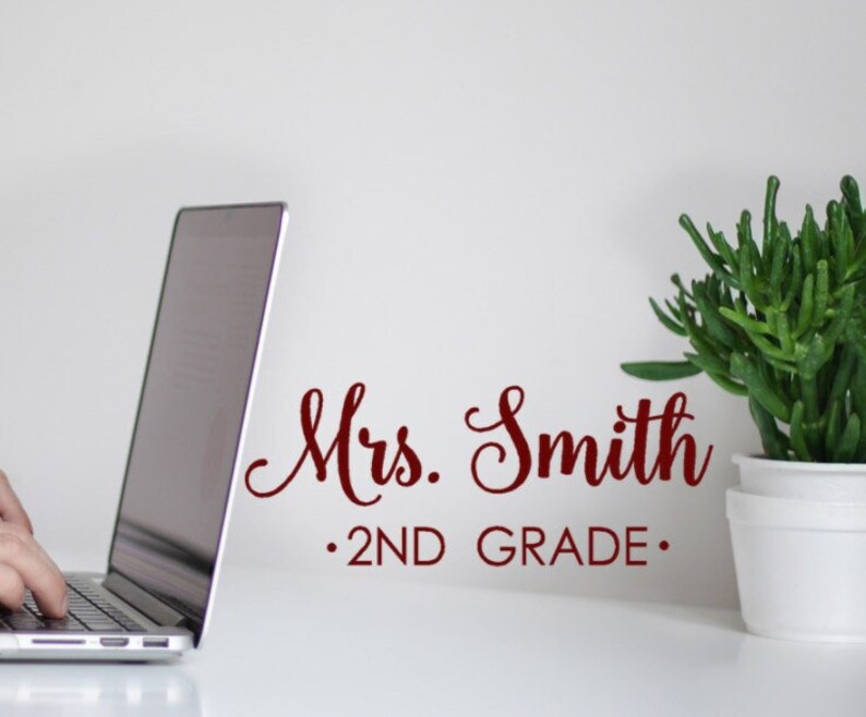 May include: A white background with a red cursive text that reads "Mrs. Smith . 2ND GRADE."
