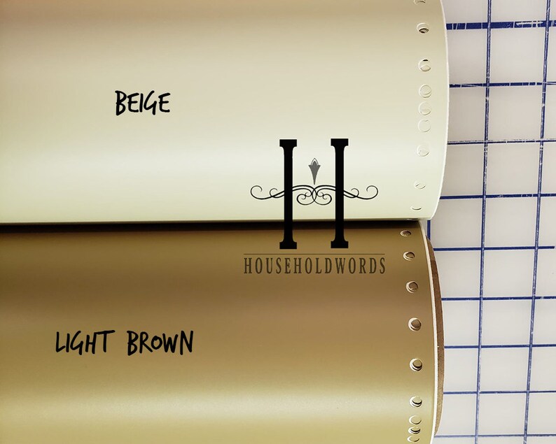 May include: Two rolls of vinyl adhesive film, one beige and one light brown. The rolls are labelled with the colour names and the brand "HOUSEHOLDWORDS".