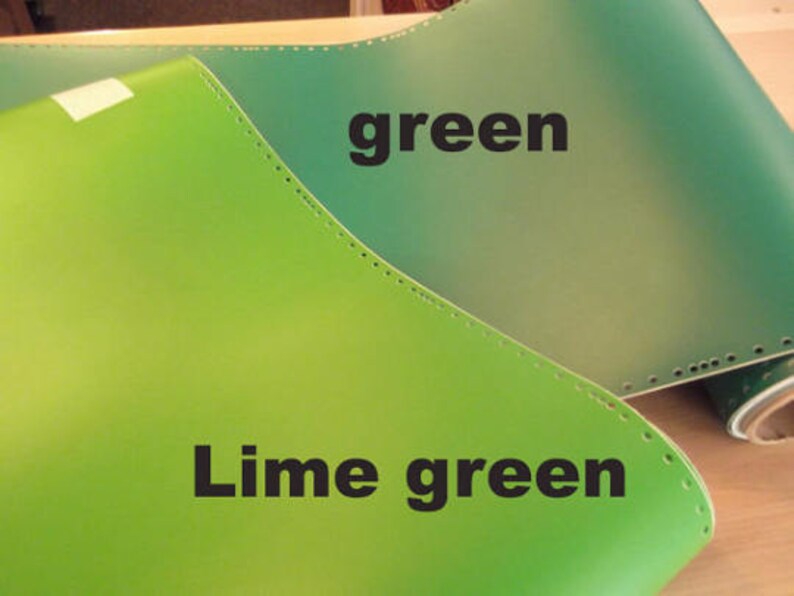 May include: Two pieces of leather in different shades of green. The top piece is a darker green and labeled "green". The bottom piece is a lighter green and labeled "Lime green".