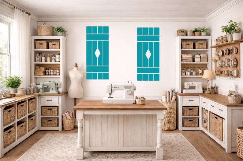 May include: A bright, well-lit craft room with white cabinetry, wooden countertops, and wicker baskets. Two teal shutter-style wall decorations flank a sewing table with a white sewing machine. Shelves are filled with supplies.