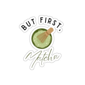 May include: A white sticker with the words "BUT FIRST, Matcha" and an illustration of a matcha bowl and whisk. The matcha is green, the whisk is brown. The text and illustration are in a playful style.