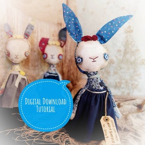 May include: Three handmade fabric bunny dolls with long ears and button eyes. The bunnies wear dresses in various colors and patterns. One bunny has blue polka dot ears and a navy dress. The image includes a speech bubble that says "DIGITAL DOWNLOAD TUTORIAL".