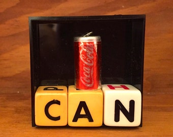 Mini-Assemblage: CAN (Coca-Cola)