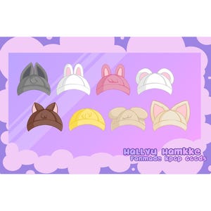 Puede incluir: Un conjunto de ocho sombreros de animales de dibujos animados en varios colores, incluyendo gris, blanco, rosa, marrón, amarillo y beige. Los sombreros están dispuestos en dos filas de cuatro. El texto "Hallyu Hamkke Fanmade Kpop Goods" está en la parte inferior de la imagen.