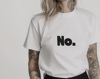 May include: White t-shirt with the word "No." printed in bold, black letters. The shirt has short sleeves. The model is wearing black trousers. The t-shirt is made of a soft material.