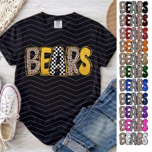 May include: A black short-sleeved t-shirt featuring the word BEARS printed in a large, stylized font. The letters alternate between a gold glitter texture, a black and white checkered pattern, and a brown leopard print design.