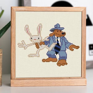 Può includere: Schema di punto croce con un coniglio e un cane di cartone animato in un abito blu. Il coniglio è bianco con orecchie lunghe e si tiene al braccio del cane. Il cane è marrone con un abito blu e un cappello.