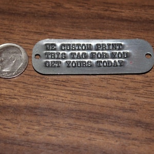 May include: A silver metal tag with the text "WE CUSTOM PRINT THIS TAG FOR YOU GET YOURS TODAY".