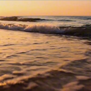 May include: A tranquil beach at sunset. The sun, a bright disc, bathes the water and sand in a golden light. Soft waves break on the shore, creating a peaceful and calming atmosphere.