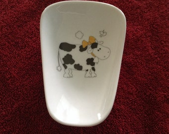 Ceramic Spoon Rest with Black and White Cow with a Yellow Bow   5" Long,  Top of Spoon 3 1/2" Wide