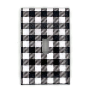 May include: Black and white checkered light switch cover plate.