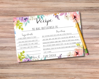 May include: A printable recipe card with a floral design. The recipe is for a No Bake Butterfinger Pie. The ingredients include a graham cracker pie crust, cream cheese, cool whip, and Butterfinger candy bars. The directions include beating the cream cheese, folding in cool whip, and crushing the candy bars. The recipe is from the kitchen of Plain Chicken.