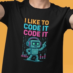 Könnte beinhalten: Schwarzes T-Shirt mit einer bunten Grafik eines Roboters mit Kopfhörern und dem Text "Ich mag es, es zu codieren, es zu codieren".
