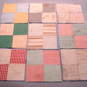 May include: Nine patchwork squares in various colors and patterns. The squares feature fabrics in shades of yellow, green, red, and blue, with patterns including gingham, stripes, and floral prints. Some squares show signs of wear and age.