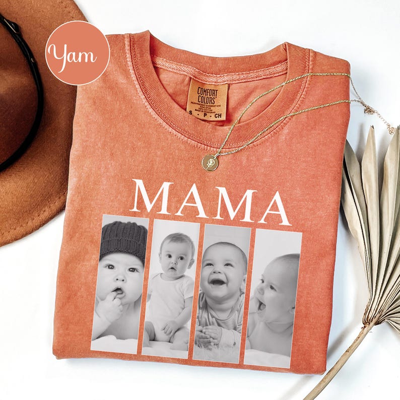 May include: A burnt orange crewneck t-shirt featuring the word MAMA in white capital letters above four vertical black and white photographic panels showing a baby in different poses. The shirt has a Comfort Colors brand label at the neck.