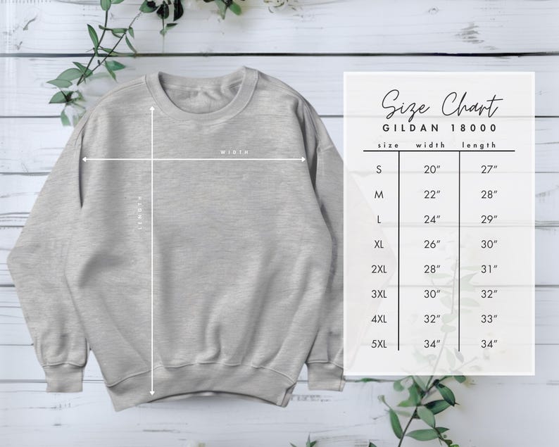 May include: A light gray Gildan 18000 sweatshirt with a size chart. The size chart shows the width and length measurements for sizes S through 5XL, ranging from 20 inches to 34 inches in width and 27 inches to 34 inches in length.