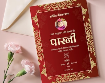 May include: Red and gold invitation card with a photo of a baby girl. The card is decorated with intricate gold designs and the text "Haadik Nimantarna" and "Pasni" in gold lettering. The date and time of the event are also included on the card.