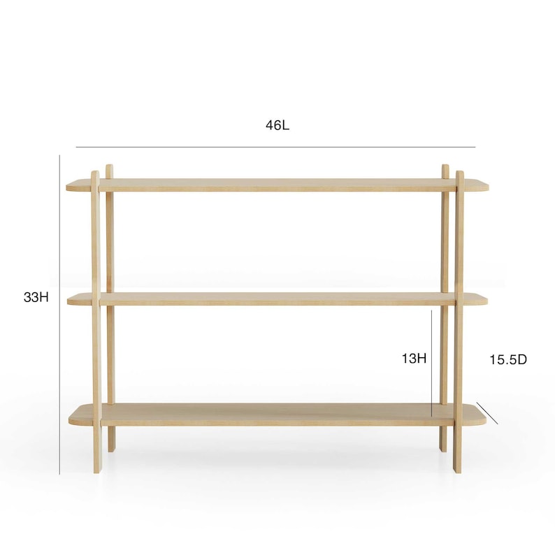 May include: A light-colored wooden bookshelf with three shelves. The bookshelf is 46 inches long, 33 inches high, and 15.5 inches deep. The height between the shelves is 13 inches.