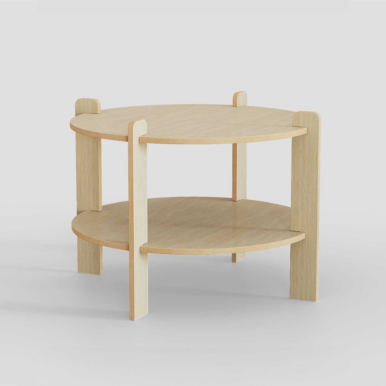 Peut inclure: Une table d'appoint en bois clair &agrave; deux niveaux. La table comporte deux &eacute;tag&egrave;res circulaires soutenues par des montants verticaux et de petits accents rectangulaires en haut. Le design est minimaliste et moderne, adapt&eacute; &agrave; divers styles de d&eacute;coration int&eacute;rieure.