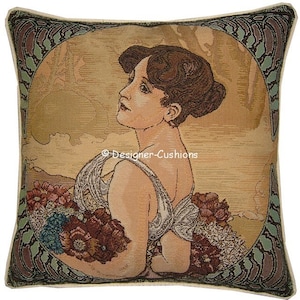 May include: A tapestry cushion cover featuring a woman with brown hair holding a bouquet of flowers. The background is a muted gold with a green and brown border.