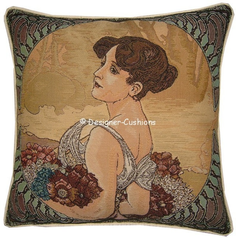 May include: A tapestry cushion cover featuring a woman with brown hair holding a bouquet of flowers. The background is a muted gold with a green and brown border.