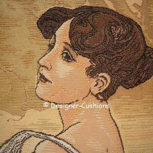 May include: A tapestry featuring a woman with brown hair, wearing a white dress. The background is a light brown color with a textured pattern.