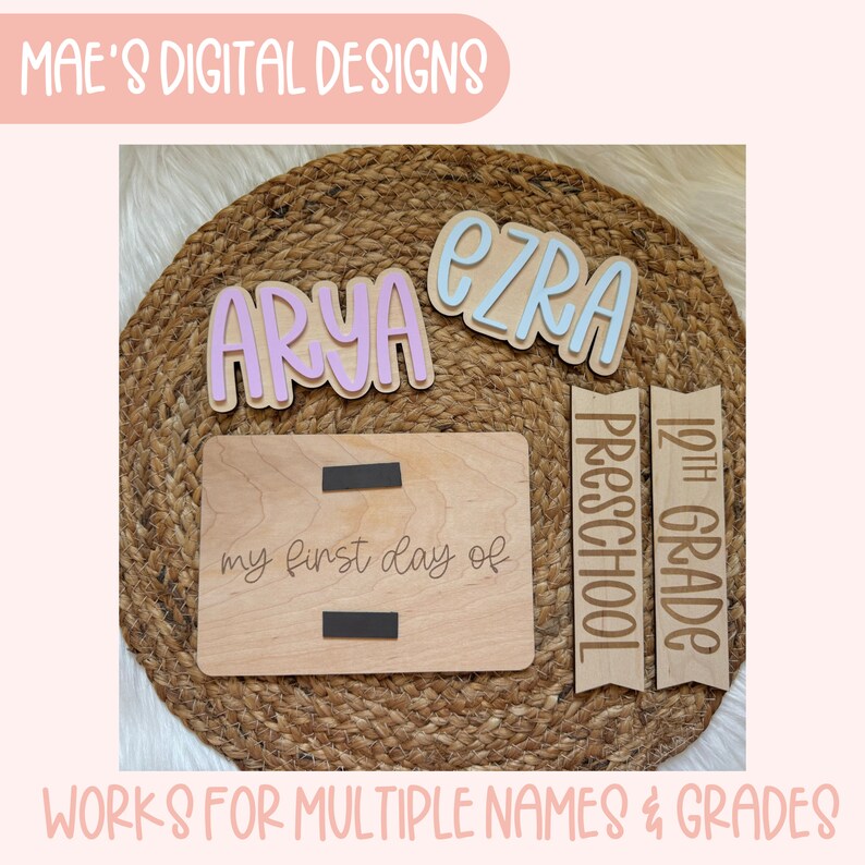 May include: Wooden sign with the text "my first day of" and two blank spaces for names or grades.  The sign is surrounded by other wooden signs with the names "Arya" and "Ezra" and the grades "12th Grade" and "Preschool".