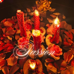 May include: A romantic scene featuring three lit red candles surrounded by rose petals, roses, and sliced fruit. The word "Passion" is written in a glowing script across the image. A golden statue is in the background.