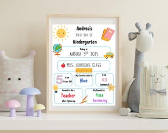 May include: A framed print for a child's first day of kindergarten, featuring the text "Andrea's First Day of Kindergarten." The print includes a sun, globe, apple, ruler, car, and star illustrations. The child is 5 years old and 42 inches tall.