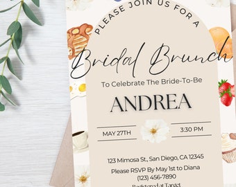 Puede incluir: Invitación a un brunch nupcial con ilustraciones en acuarela de alimentos como cruasanes, arándanos y fresas. La invitación presenta el texto "Please Join Us For A Bridal Brunch" y los detalles del brunch nupcial de Andrea el 27 de mayo.