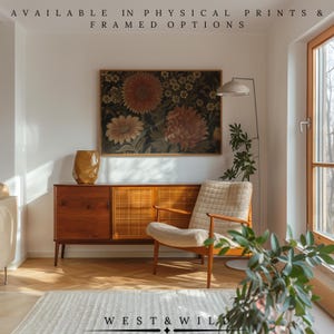 May include: A living room scene featuring a framed floral print above a wooden cabinet. A beige armchair and a floor lamp are positioned nearby. The text "AVAILABLE IN PHYSICAL PRINTS & FRAMED OPTIONS" is at the top, and "WEST & WILD" is at the bottom.