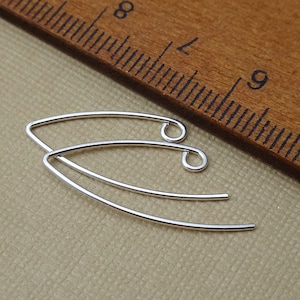 May include: Two silver earring hooks with a curved shape and a small loop at the end.