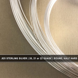May include: A close-up of a bundle of silver wire. The wire is .925 sterling silver and is available in 20, 21, or 22 gauge. The wire is round and half hard.