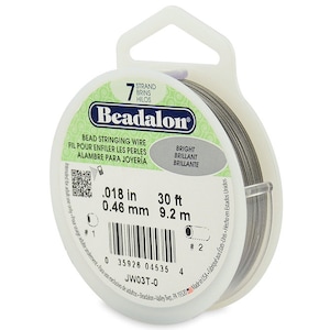 May include: A spool of 7-strand bead stringing wire in a clear plastic container. The wire is 0.018 inches (0.46 mm) thick and 30 feet (9.2 meters) long. The label reads "Beadalon Bead Stringing Wire" and "Bright Brilliant Brillante".