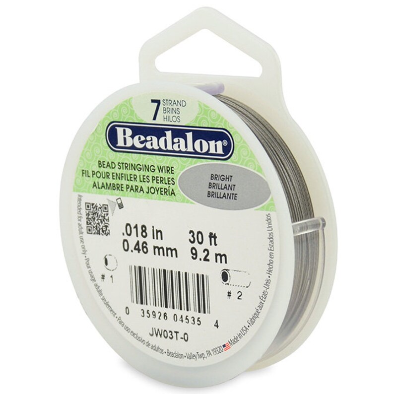 May include: A spool of 7-strand bead stringing wire in a clear plastic container. The wire is 0.018 inches (0.46 mm) thick and 30 feet (9.2 meters) long. The label reads "Beadalon Bead Stringing Wire" and "Bright Brilliant Brillante".